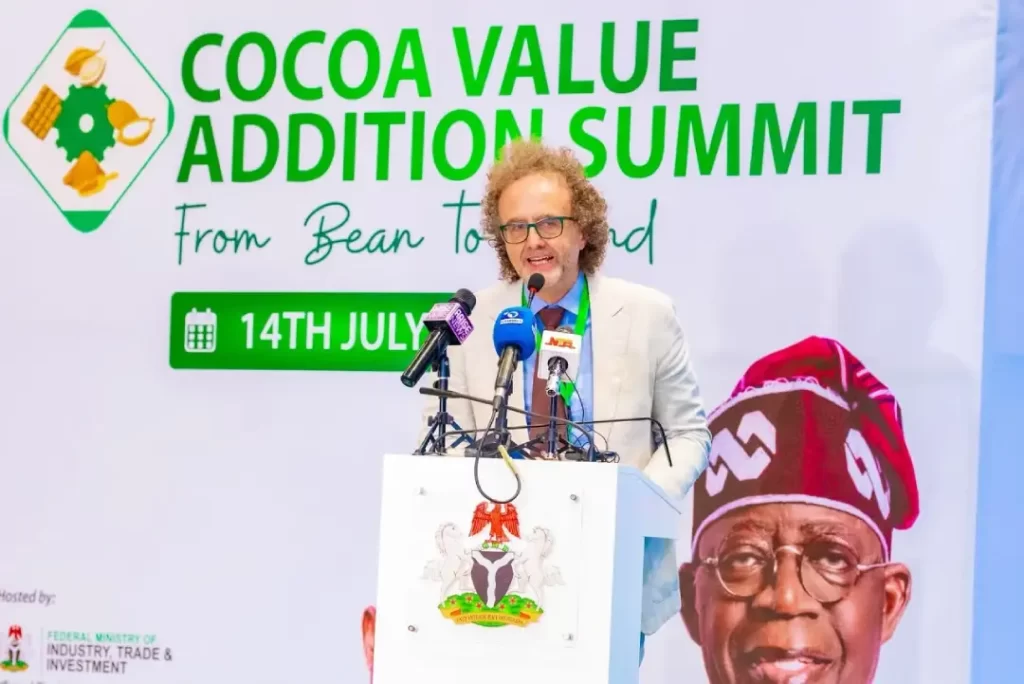 De-Luca, Head of Cooperation of the European Union Delegation to Nigeria, speaking at the podium under the Cocoa Value Addition Summit banner.